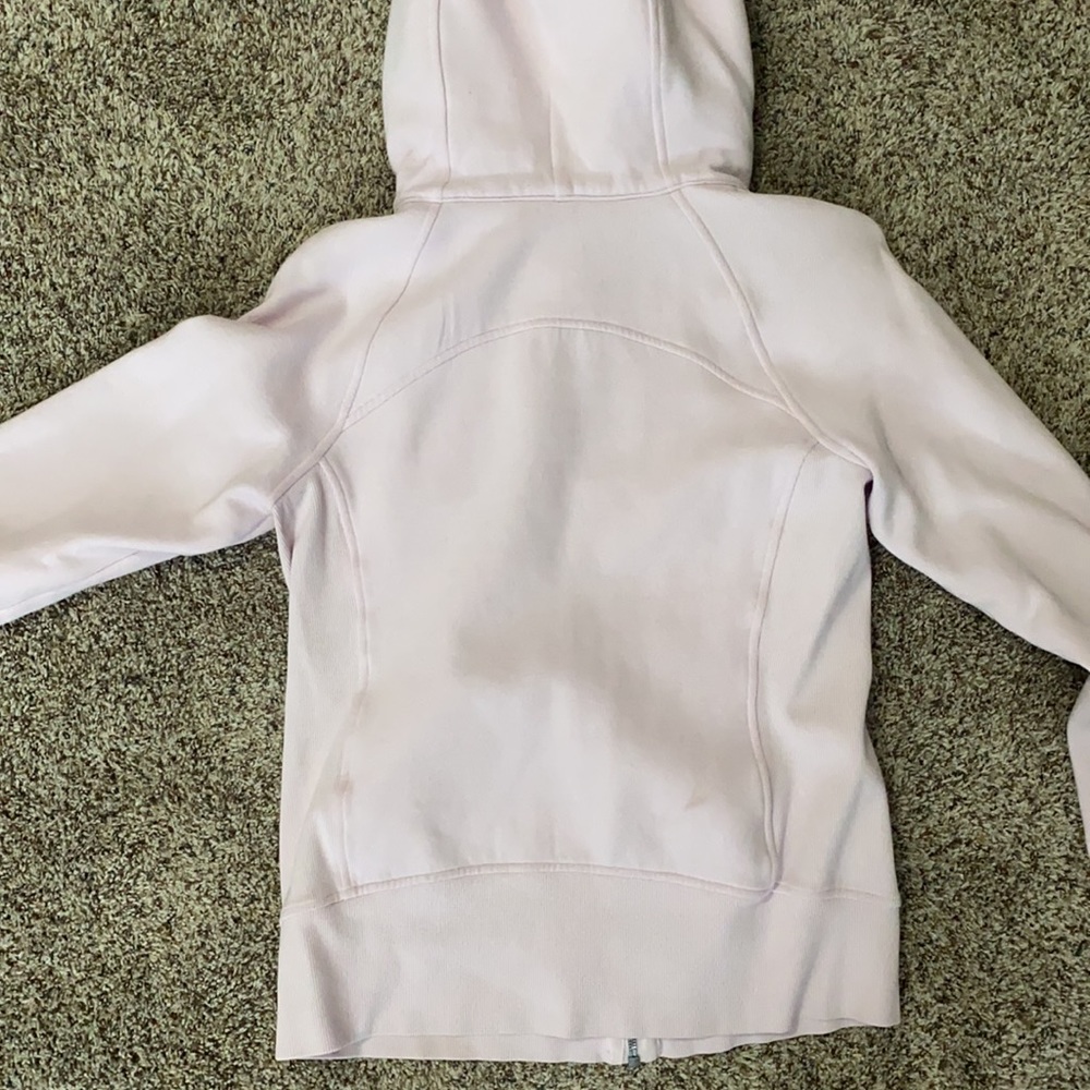 This is a light pink lululemon athletic jacket. It is a size 8. - Picture 2 of 4